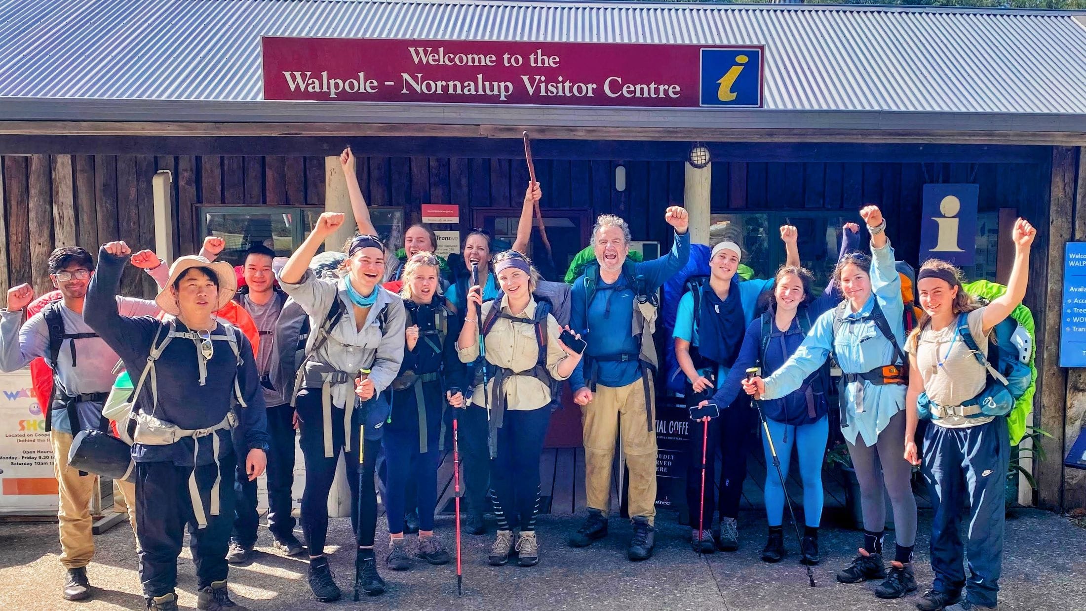 Teens celebrating the completion of their seven-day hike at the Walpole Visitor Centre